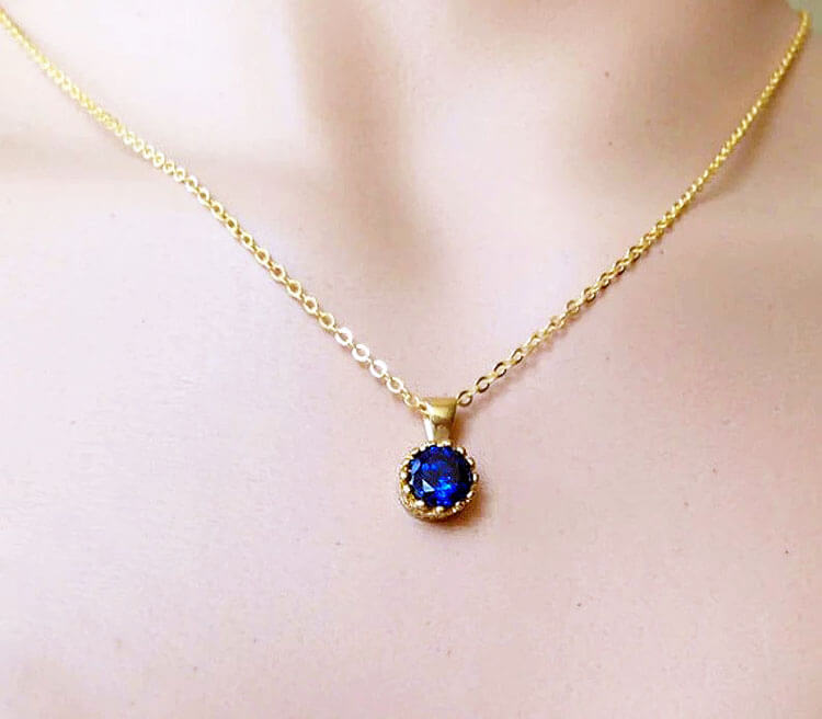 Enchanting 7mm round vivid blue sapphire pendant. Give your exquisite gemstone center stage in a mount that specializes in understated elegance.