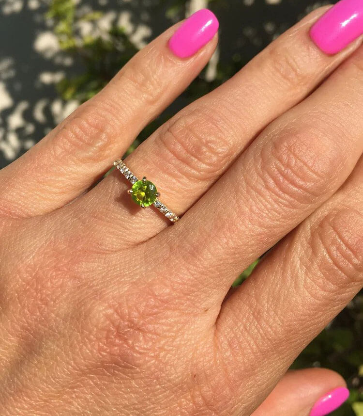 An absolute stunner, classic peridot engagement ring with a round cut gemstone of your choice as it’s centre stone and with round cut clear quartz on the band to further accentuate it.