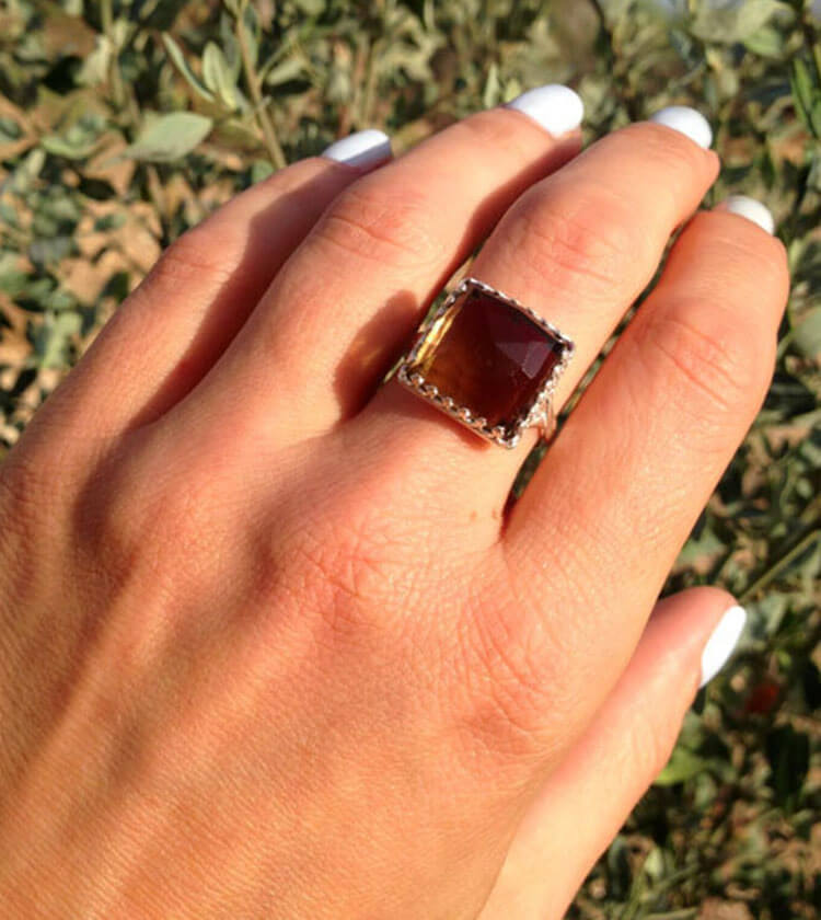 This show-stopping ring, featuring a square genuine smoky quartz gemstone within a square crown design.