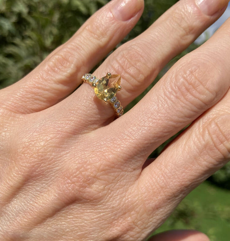 An absolute stunner, classic natural citrine engagement ring with a pear cut gemstone of your choice as it’s centre stone and with round cut clear quartz on the band to further accentuate it.