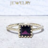 This gorgeous quartz ring displays simple elegance in its design. The ring features a square-cut natural garnet gemstone and is finished with a delicate hammered band.