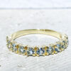 This stylish aquamarine half eternity ring is beautifully displayed, the fine craftsmanship shows off the row of blue aquamarine, and their stunning sparkle. It's a beautiful gift ring for anybody who loves gemstones.