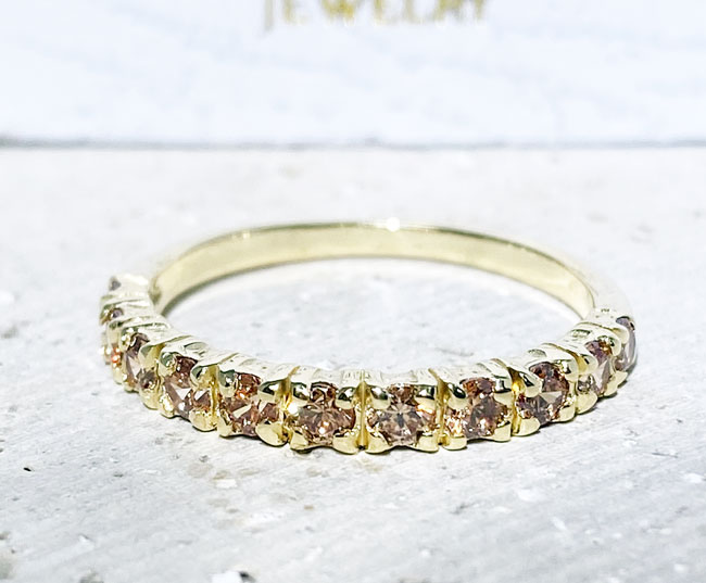 This stylish quartz half eternity ring is beautifully displayed, the fine craftsmanship shows off the row of champagne citrine, and their stunning sparkle.