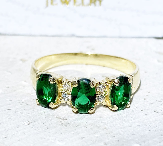 Your loved one will not be able to resist this ravishing handcrafted three-stone ring. The sparkling emerald gemstones give it a truly elegant look. A stunning gift that she is sure to cherish for life.