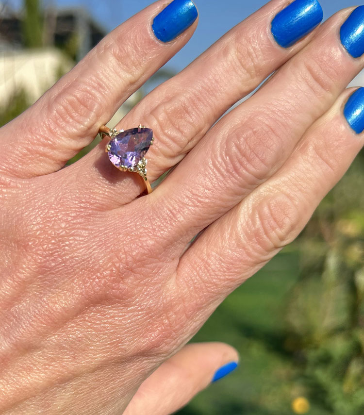 An absolute stunner, classic natural purple amethyst engagement ring with a pear cut gemstone of your choice as it’s centre stone and with round cut clear quartz on the band to further accentuate it.