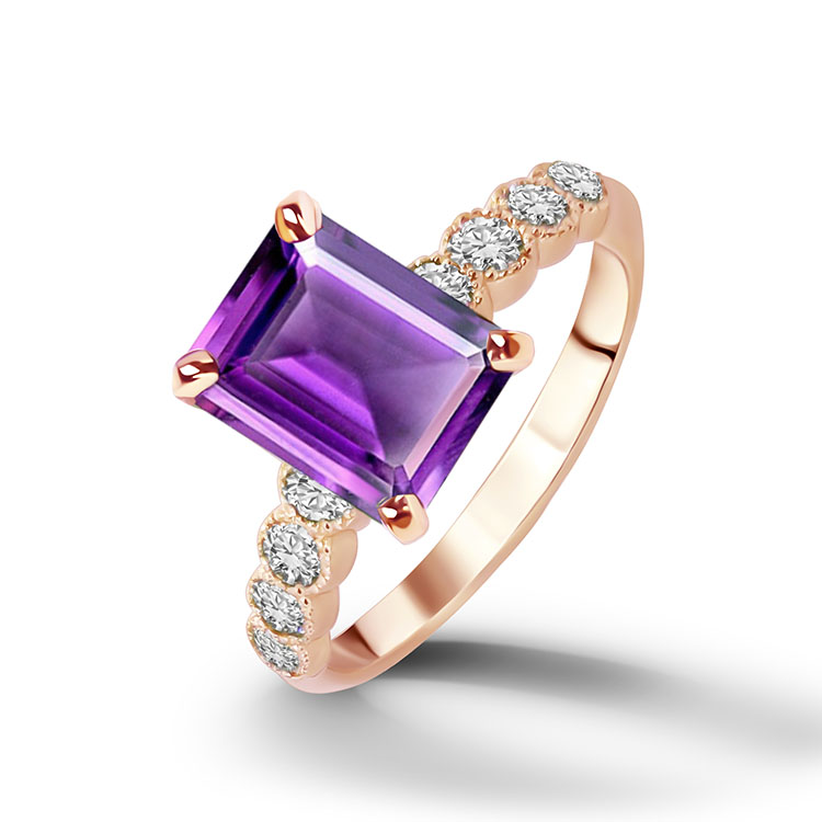 An absolute stunner, classic natural amethyst engagement ring with an emerald cut gemstone of your choice as it’s centre stone and with round cut clear quartz on the band to further accentuate it.