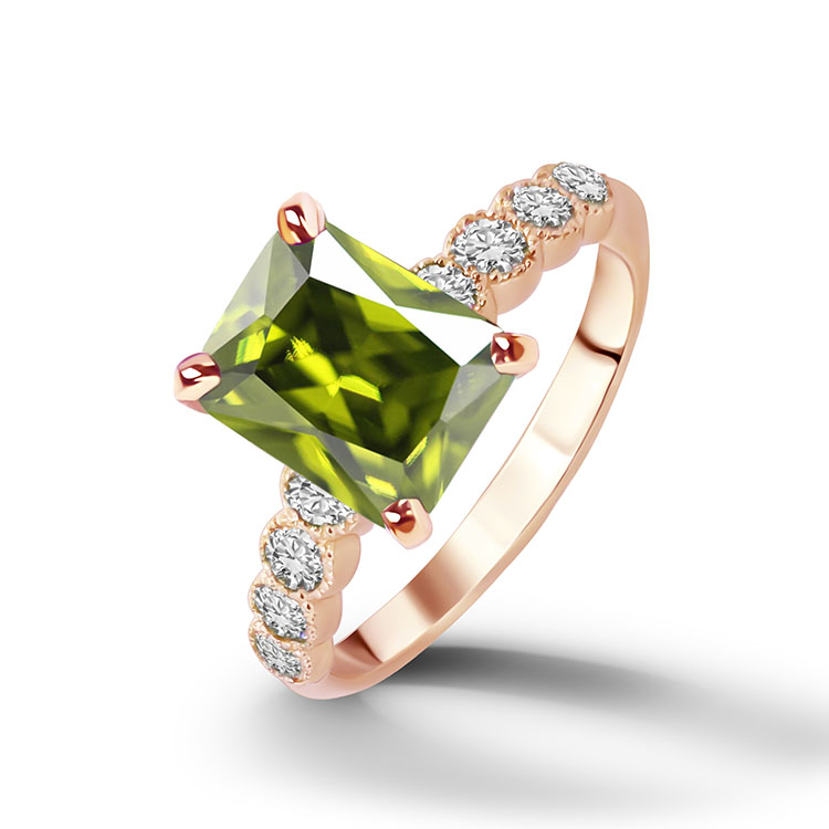 An absolute stunner, classic engagement ring with a peridot gemstone as it’s centre stone and with round cut clear quartz on the band to further accentuate it.