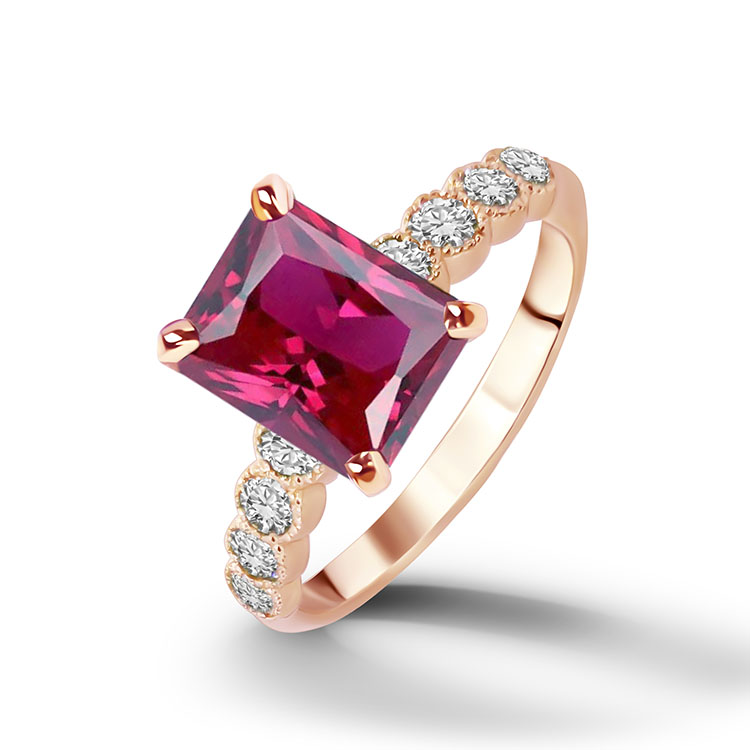 An absolute stunner, classic ruby engagement ring with an emerald cut gemstone of your choice as it’s centre stone and with round cut clear quartz on the band to further accentuate it.