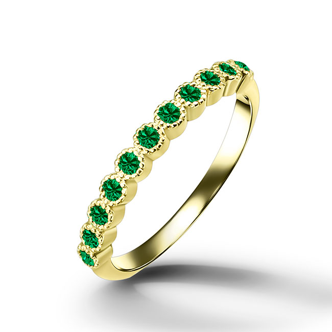 This stylish emerald half eternity ring is beautifully displayed, the fine craftsmanship shows off the row of emeralds and their stunning sparkle. It's a beautiful gift ring for anybody who loves gemstones.