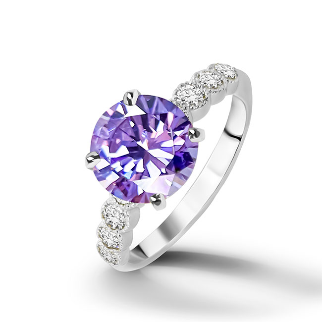 An absolute stunner, classic lavender amethyst engagement ring with a round cut gemstone of your choice as it’s centre stone and with clear quartz on the band to further accentuate it.