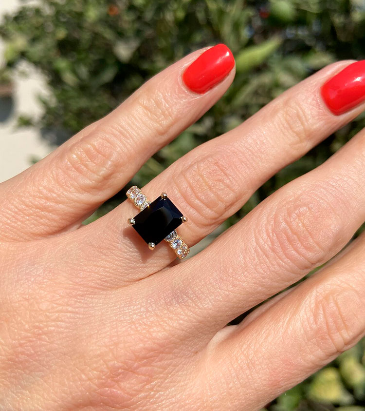 An absolute stunner, classic engagement ring with a black onyx gemstone of your choice as it’s centre stone and with round cut clear quartz on the band to further accentuate it.
