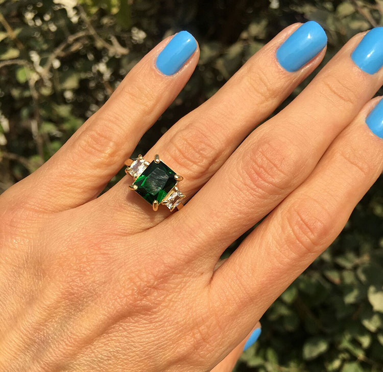 An absolute stunner, classic emerald engagement ring with an octagon cut gemstone of your choice as it’s centre stone and with clear quartz on the band to further accentuate it.