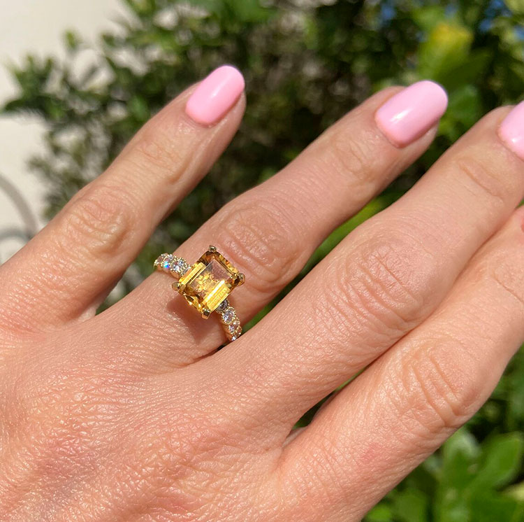 An absolute stunner, classic natural citrine engagement ring with an emerald cut gemstone of your choice as it’s centre stone and with round cut clear quartz on the band to further accentuate it.